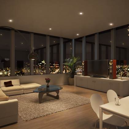a modern living room with a view of the city at night.
