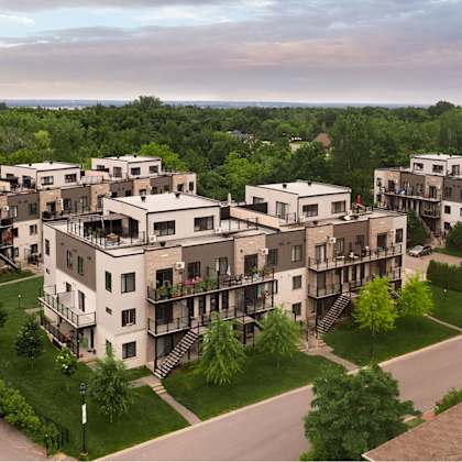 apartment complex with multiple buildings and greenery.