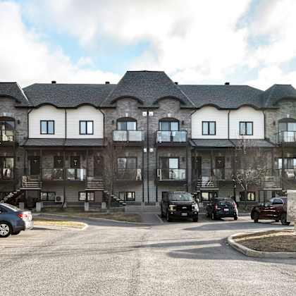 a large building with a parking lot in front of it.