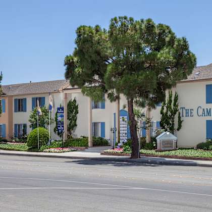 an apartment building with blue letters that read "the cambridge."