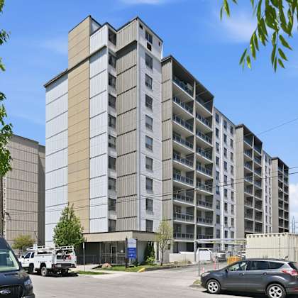 a large building with a parking lot in front of it.