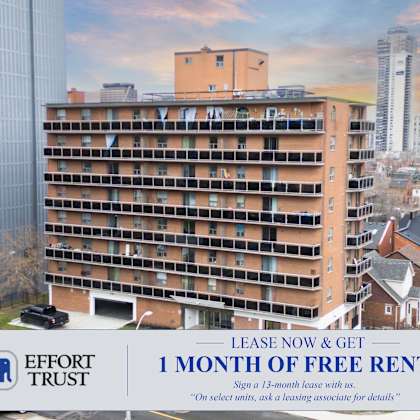a large building with a sign that says "lease now & get 1 month of free rent".