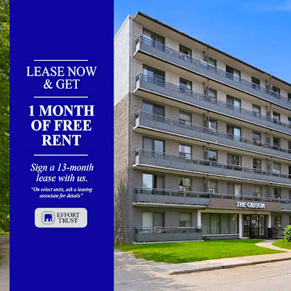 a building with a sign offering a free month of rent for signing a 13-month lease.