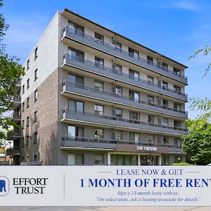 a building with a sign offering 1 month of free rent.