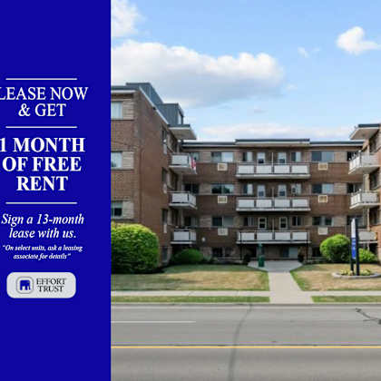 a blue sign offering a free month of rent for a 13-month lease.