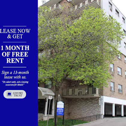 a building with a sign offering a free month of rent.