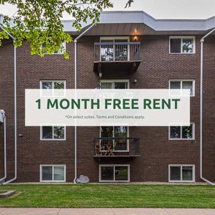 apartment complex with a sign offering a 1 month free rent.