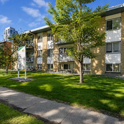 a building with a green lawn in front of it.