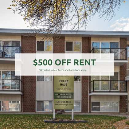 a building with a sign offering $500 off rent.