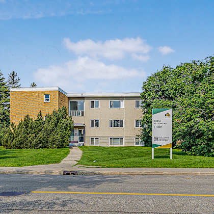 a building with a sign in front of it.