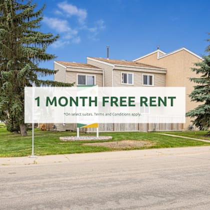 a sign offering a free one month rent is displayed in front of a house.