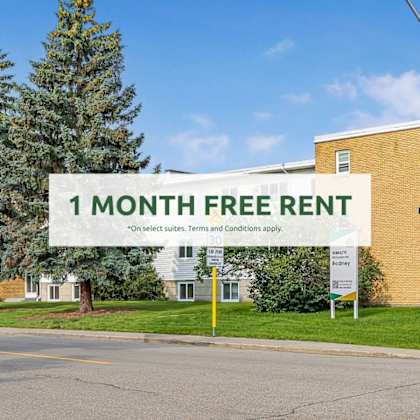 a building with a sign offering a 1 month free rent.
