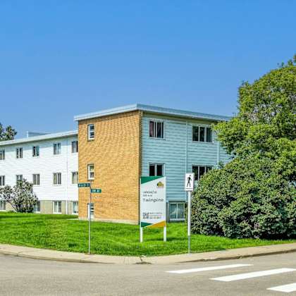 a street view of a building with a sign that says "fringe".
