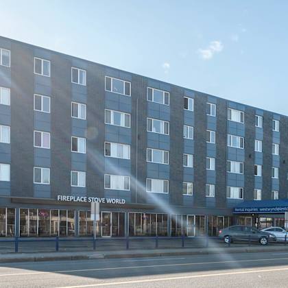 a large building with the words "fireplace stone world" on the front.
