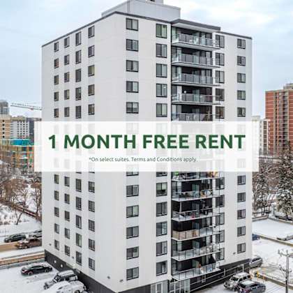 a tall white building with a sign that reads "1 month free rent".