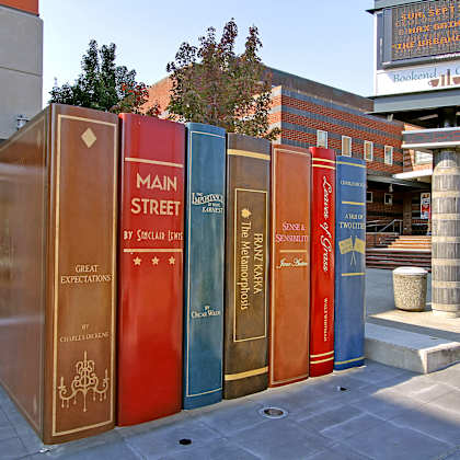 a row of books are lined up outside a building.