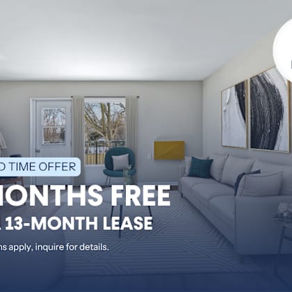 a living room with a couch and a chair, advertising a limited time offer for a free 2 months on a 13-month lease.