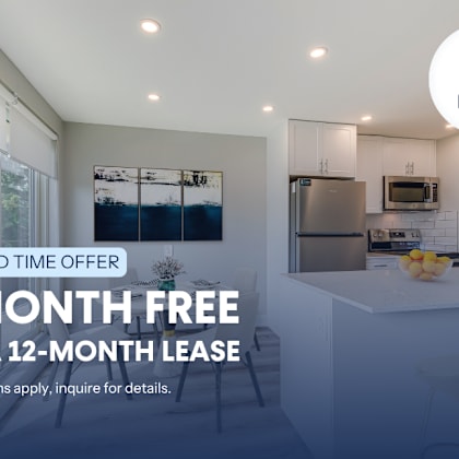 a kitchen interior with a sign offering a free month on a 12-month lease.