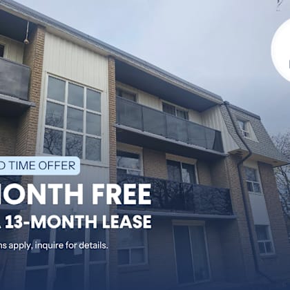a building with a sign offering a free month on a 13-month lease.