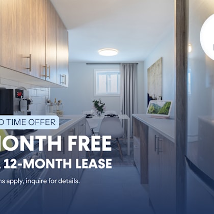a kitchen interior with a sign offering a free month on a lease.