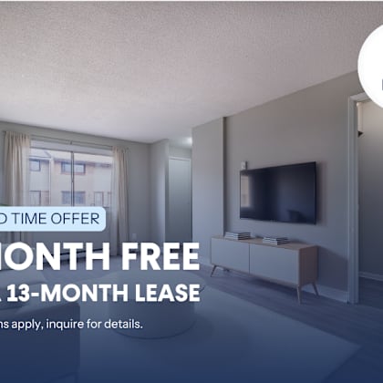 a room with a tv and a window is being advertised for a free month on a 13-month lease.