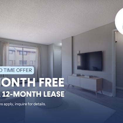 a room with a tv and a window is being advertised for a free month on a 12-month lease.