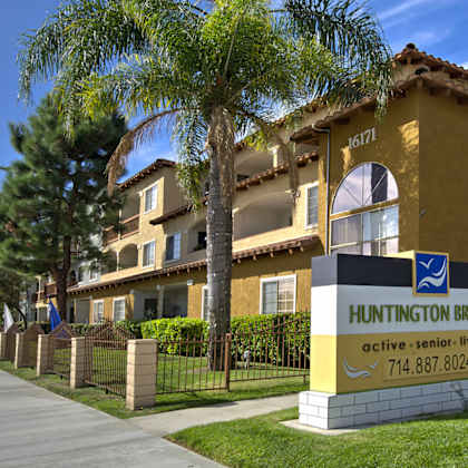 huntington breeze senior living community with a clear blue sky.