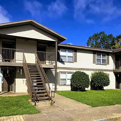 apartment complex with a clear blue sky above.
