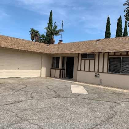 a house with a driveway and a garage door.