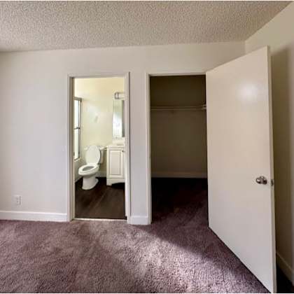 a room with a toilet in the bathroom.