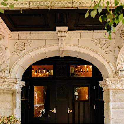 a building with a black door and a sign that reads 1653a.