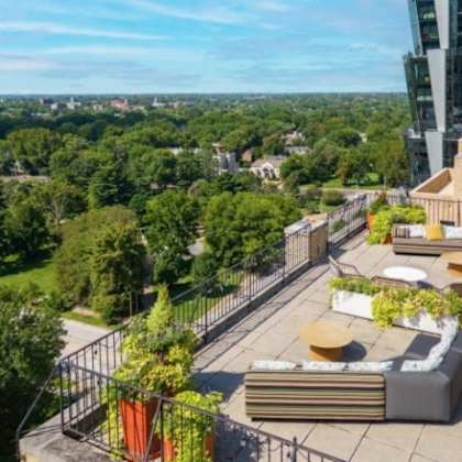 a rooftop patio with a view of the city.