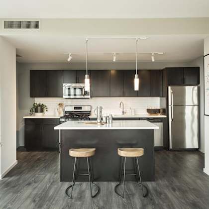 a modern kitchen with black and white decor.