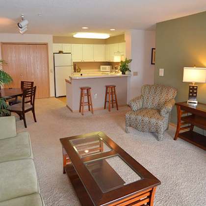 a living room with a couch, chair, and coffee table.