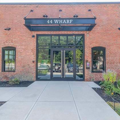 the front of a building with the name 44 wharf on it.