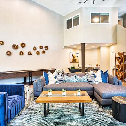 a living room with a blue couch and a wooden coffee table at mountain vista, victorville, ca
