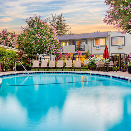 a swimming pool surrounded by a fence and trees at pleasanton place, pleasanton, ca, 94566