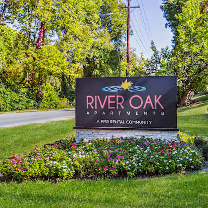 welcoming property signage at river oak apartments, louisville, ky