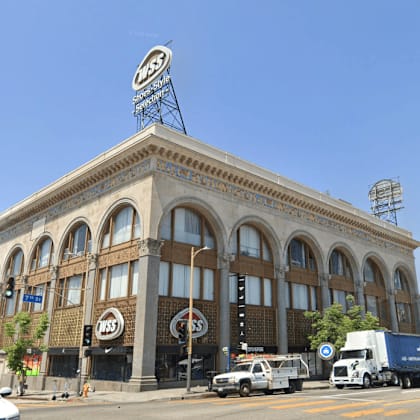 a large building with a sign on the top of it.
