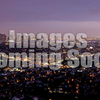 a cityscape at dusk with the text "images coming soon" superimposed on it.