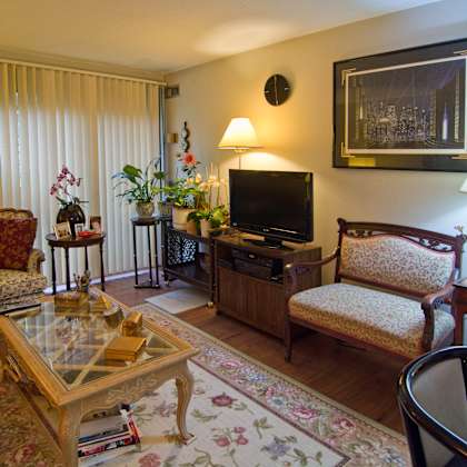 a living room filled with furniture and a television