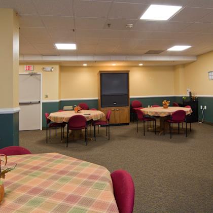 a dining room with tables and chairs in a hall