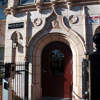 the front of a building with a red door