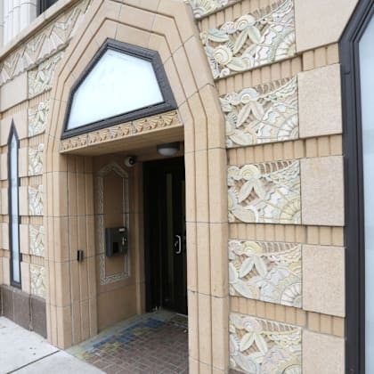 the entrance to a building with a door and a window