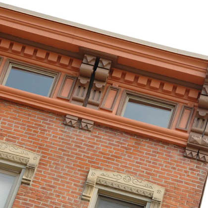 the facade of a brick building with windows