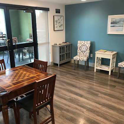 a dining room with a wooden table and chairs.