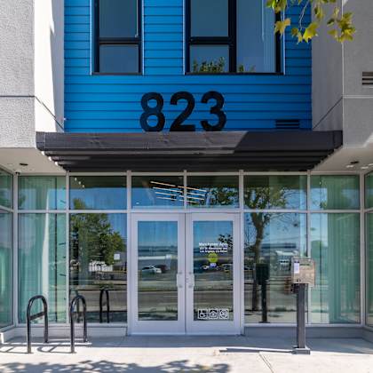 the entrance to a building with the number 823 on it.