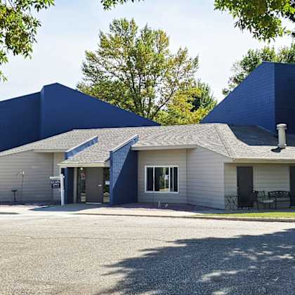 a large blue building with a sign that says "windemere" in front of it.