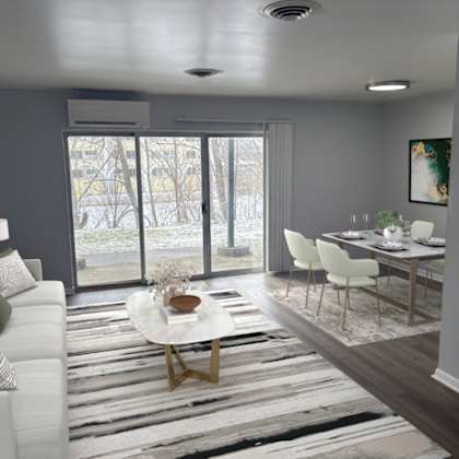 a modern living room with a white sofa and a coffee table.