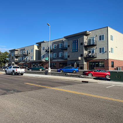 an apartment building on the side of a street